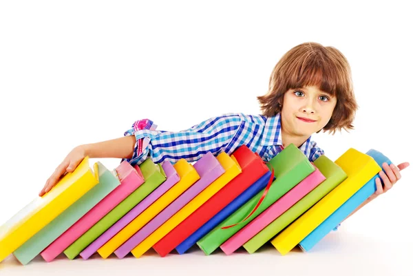 Bambino con pila di libri . — Foto Stock