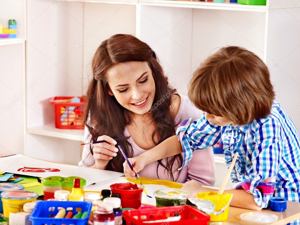 Family with child painting .