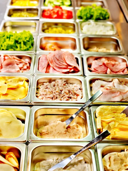 Tray with food on showcase at cafeteria — Stock Photo, Image