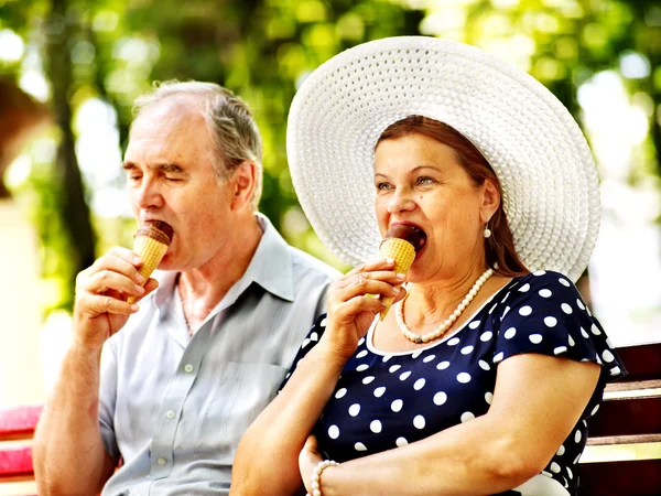 Happy old couple with ice-cream. — Stock Photo, Image