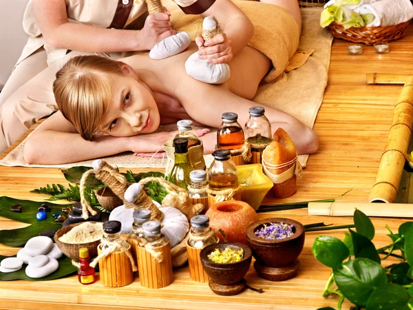 Woman getting herbal ball massage . — Stock Photo, Image