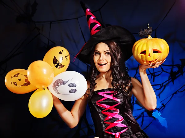 Happy woman holding pumpkin and balloon. — Stock Photo, Image