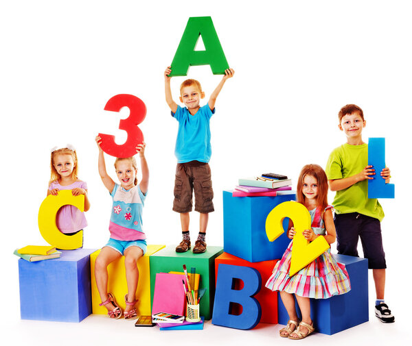 Children sitting at cube.