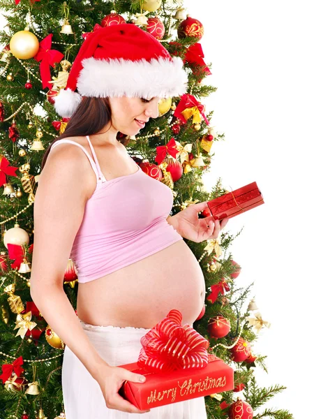 Pregnant woman holding Christmas box. — Stock Photo, Image