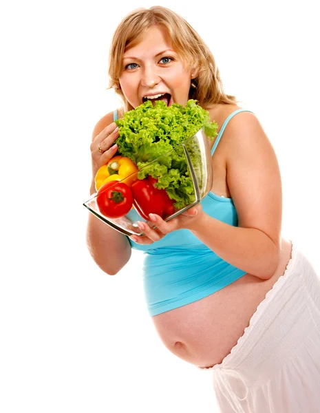 Gravid kvinna förbereda mat . Stockfoto