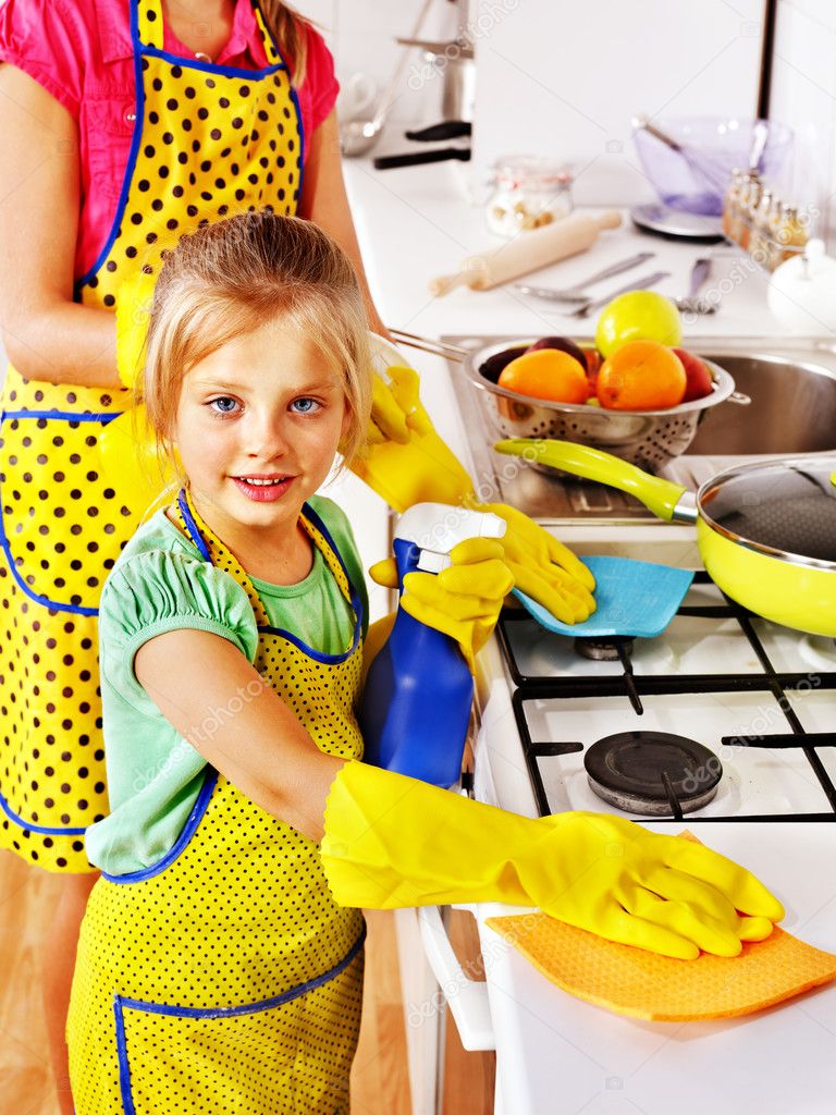 Children cleaning kitchen.
