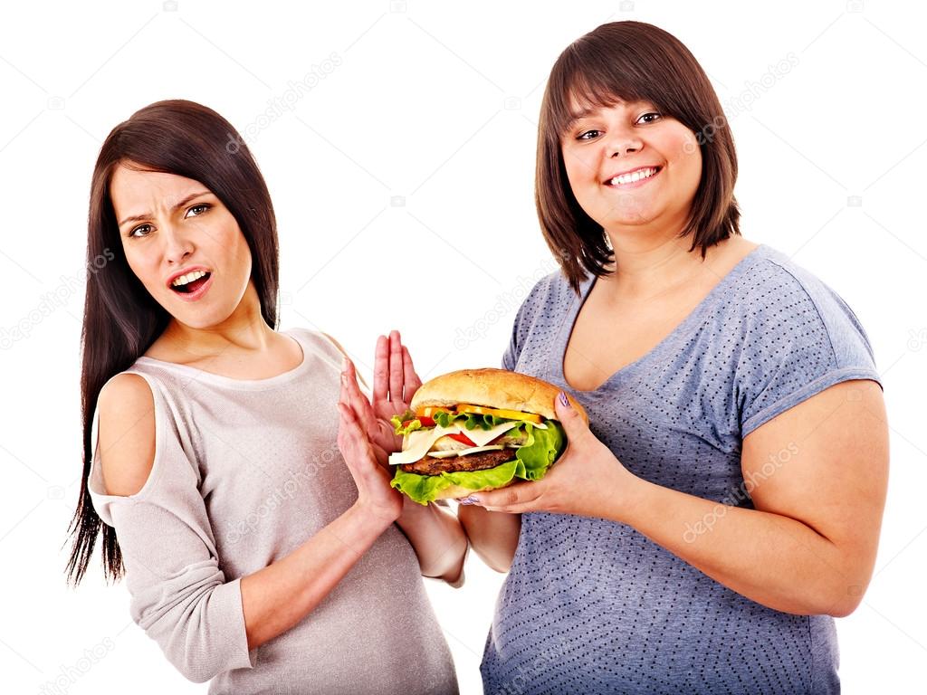 Women eating hamburger.