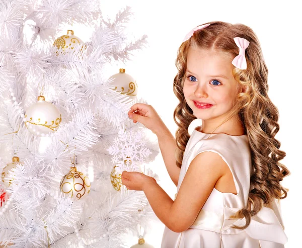 Child decorate Christmas tree. Stock Image