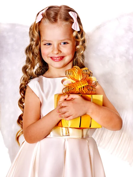 Child at angel costume holding gift box. — Stock Photo, Image