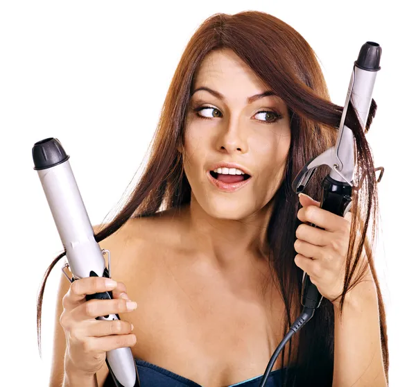 Woman holding iron curling hair. — Stock Photo, Image