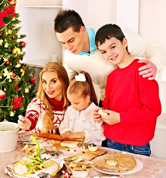 Family with children rolling dough in Xmas kitchen. — Stock Photo, Image