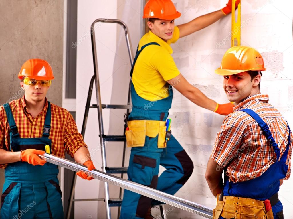 Men in builder uniform.
