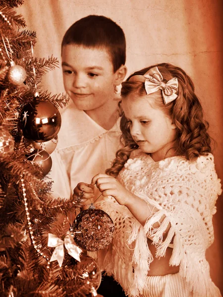 Child decorate on Christmas tree. — Stock Photo, Image