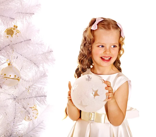 Child decorate white Christmas tree. Stock Image
