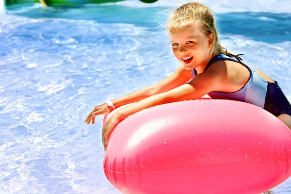 Child on water slide at aquapark. — Stock Photo, Image