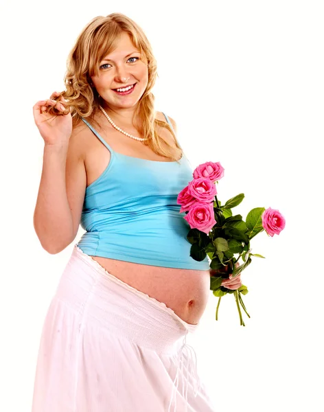 Беременная женщина с цветами . — стоковое фото