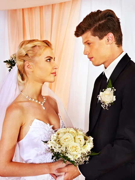 Wedding couple holding flower. — Stock Photo, Image