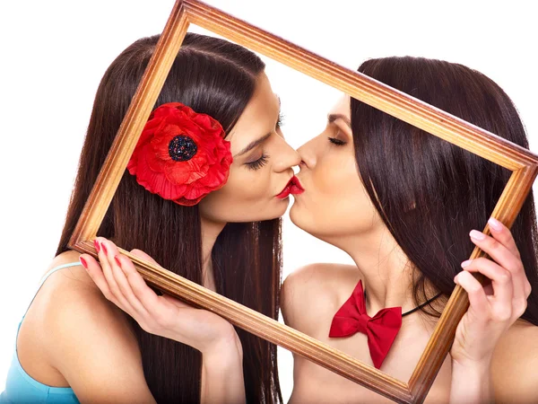 Two sexy lesbian women kissing in art frame. — Stock Photo, Image