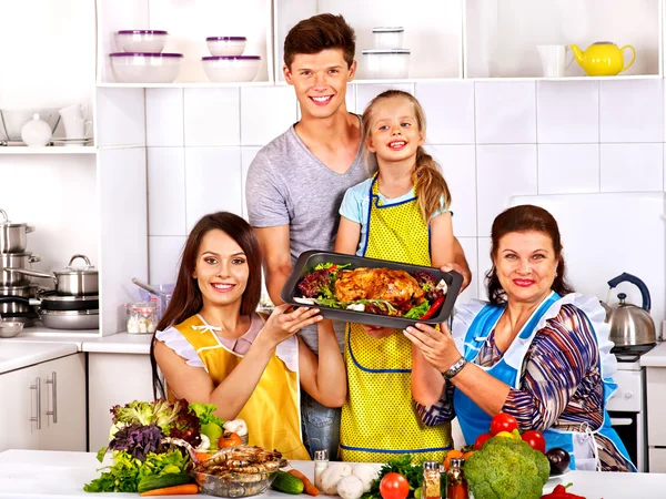 Happy family with grandmother at kitchen. — Stock Photo, Image