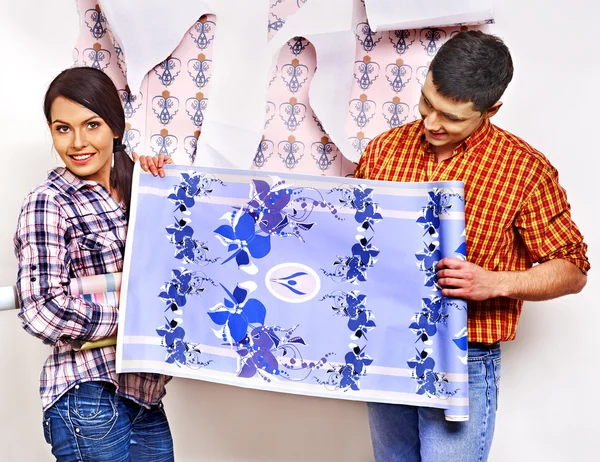 Family glues wallpaper at home. — Stock Image Family glues wallpaper at home. Stock Picture