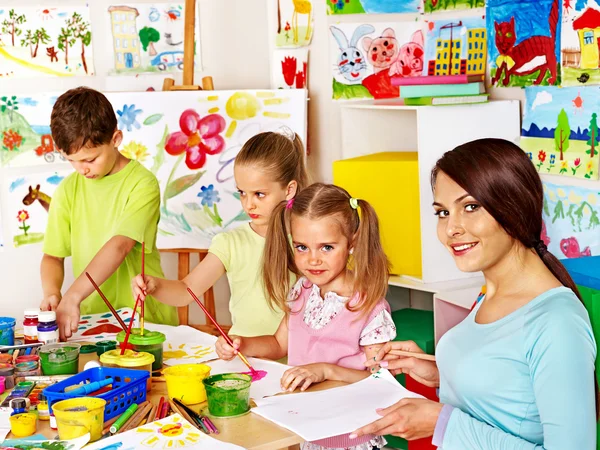 Children with teacher painting. — Stock Photo, Image