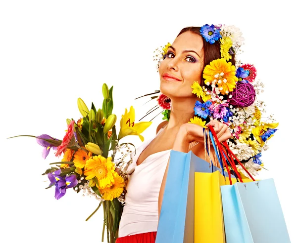 Mulher com saco de compras segurando flor . — Fotografia de Stock
