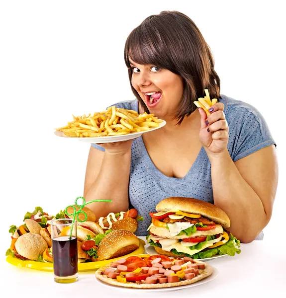 Frau isst Fast Food. — Stockfoto