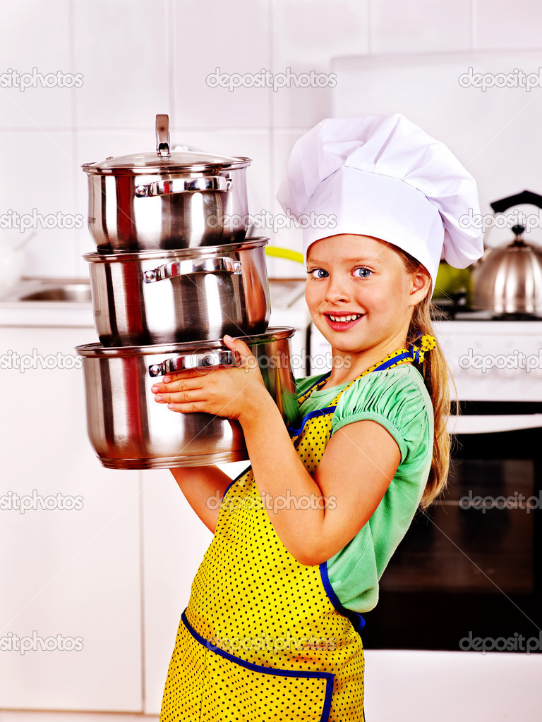 Child cooking at kitchen.