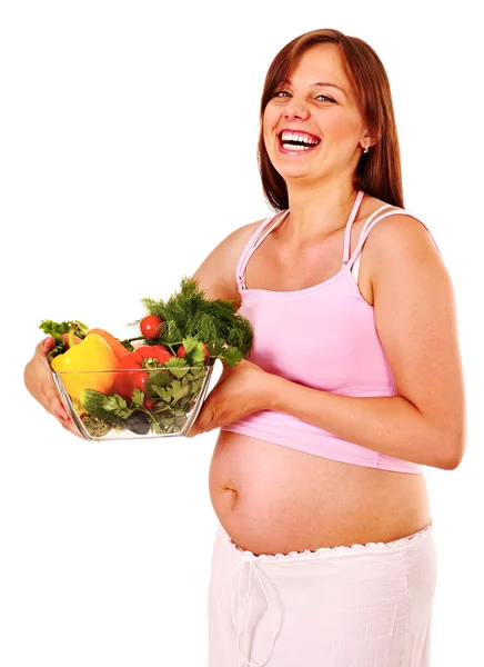 Mujer embarazada comiendo vegetales . — Foto de Stock