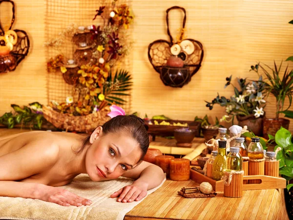 Woman getting massage in bamboo spa. — Stock Photo, Image