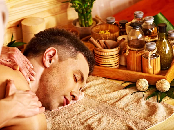 Man getting bamboo massage. — Stock Photo, Image