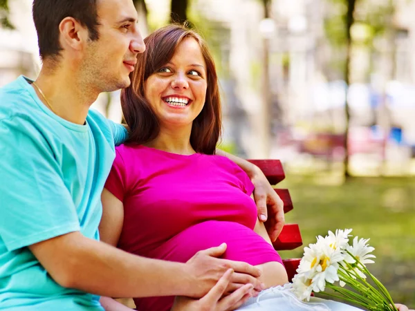 Pregnant woman with man outdoor. — Stock Photo, Image