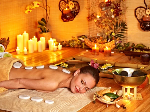 Woman getting massage in bamboo spa. — Stock Photo, Image
