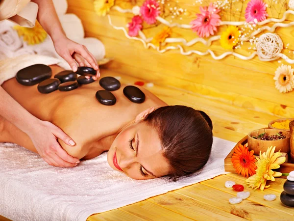 Woman getting stone therapy massage . — Stock Photo, Image