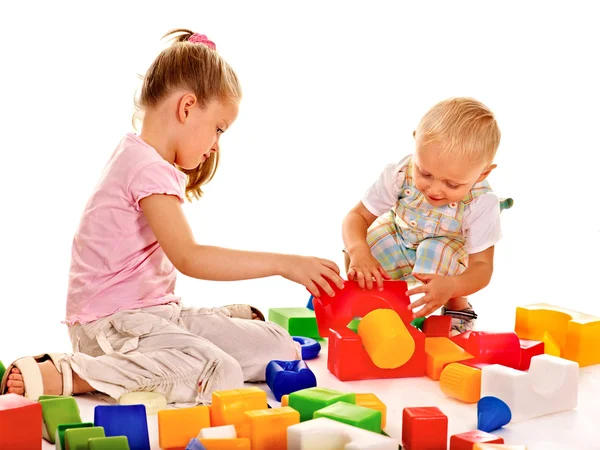 Children play building blocks. Stock Photo