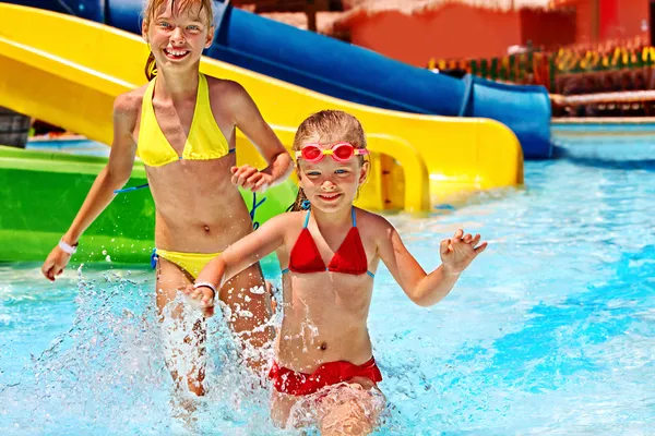 Children on water slide at aquapark. — Stock Photo, Image