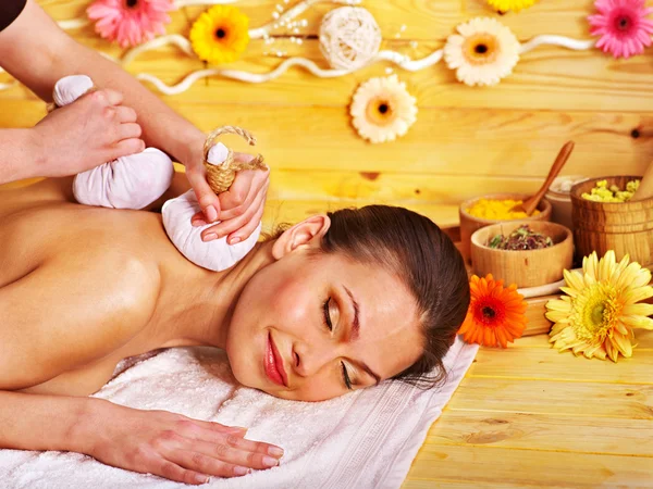 Woman getting herbal ball massage. — Stock Photo, Image