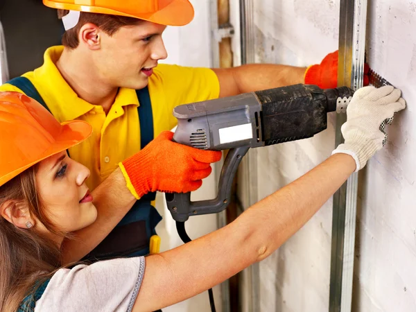 Familia en uniforme de constructor — Foto de Stock