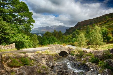 Ashness Bridge over small stream in Lake District clipart