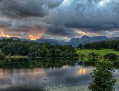 Sunset at Loughrigg Tarn in Lake District clipart