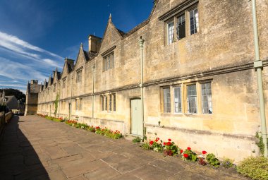 Traditional cotswold stone almshouses clipart