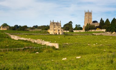 Church St James across meadow in Chipping Campden clipart