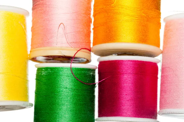 Multiple bobbins of cotton thread — Stock Photo, Image