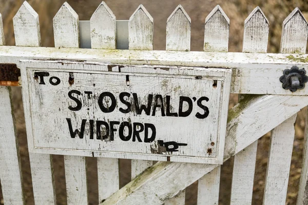 Signpost for footpath to St Oswalds church — Stock Photo, Image