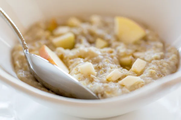 Oatmeal breakfast in modern white bowl — Stock Photo, Image