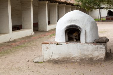 Old bread oven in garden of mission clipart