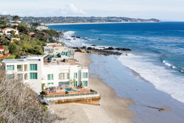 Houses by ocean in Malibu california clipart