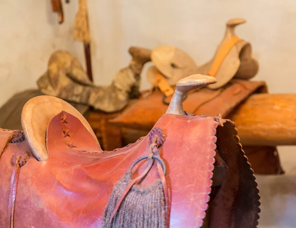 Hand made saddles in spanish mission — Stock Photo, Image