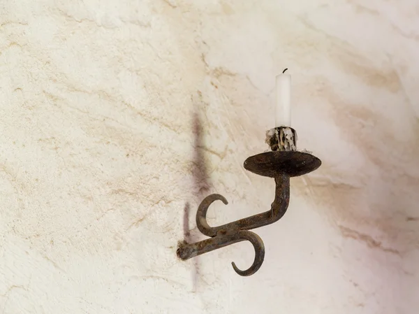 Old iron candlestick holder on table — Stock Photo, Image