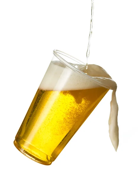 Golden lager or beer in disposable plastic cup — Stock Photo, Image